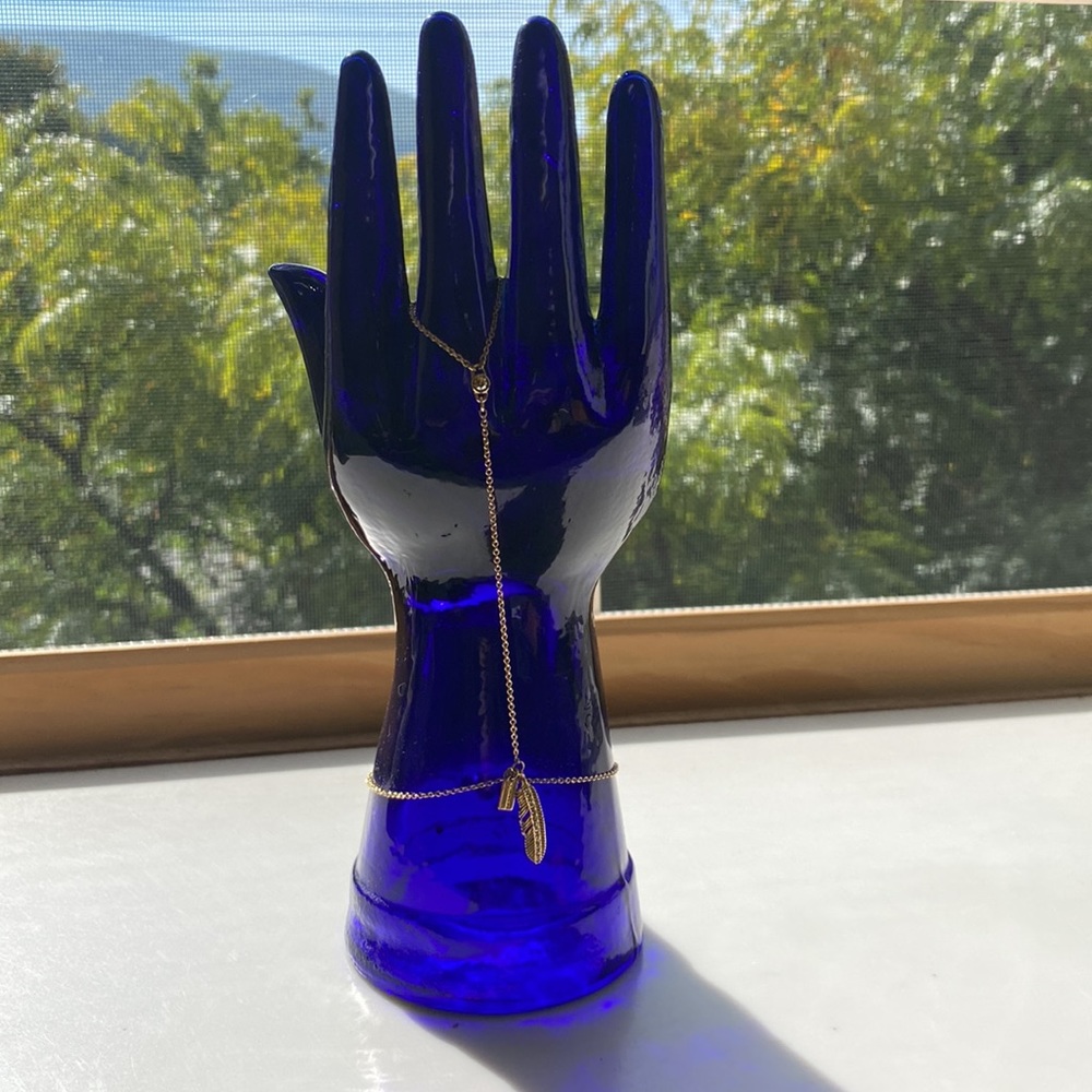 Coach feather hand chain